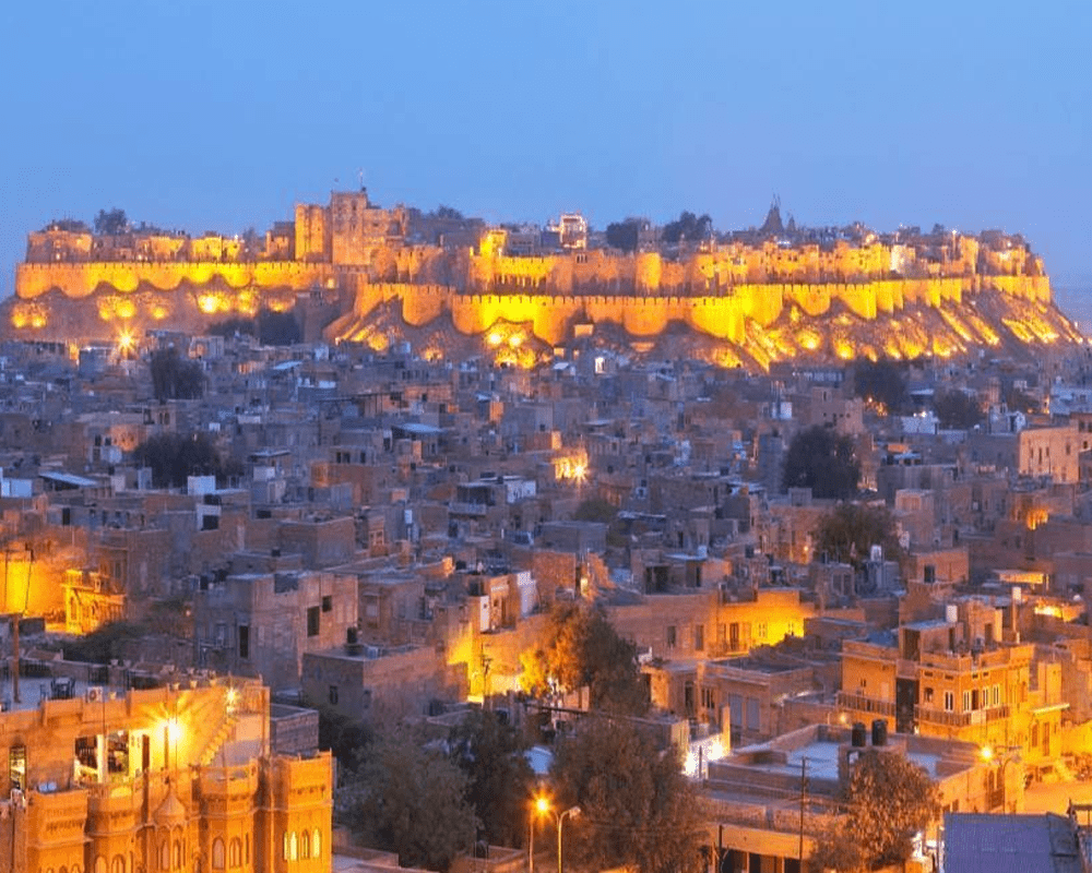 Golden fort lit up at night above the old city, Rajasthan