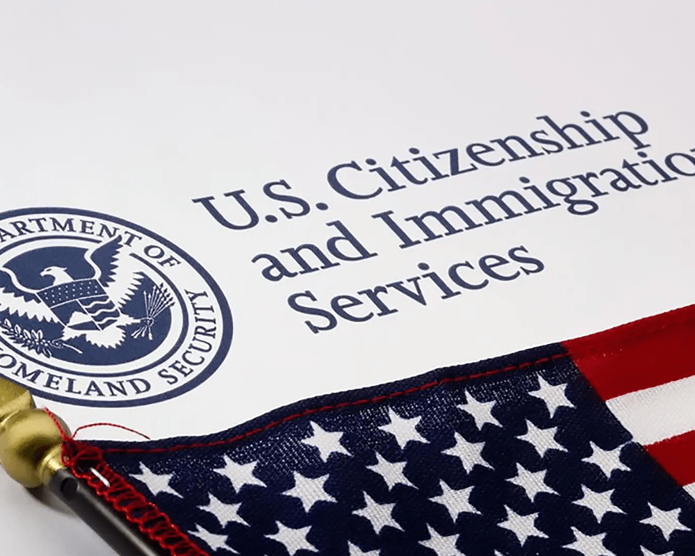 US Citizenship and Immigration Services document with the American flag