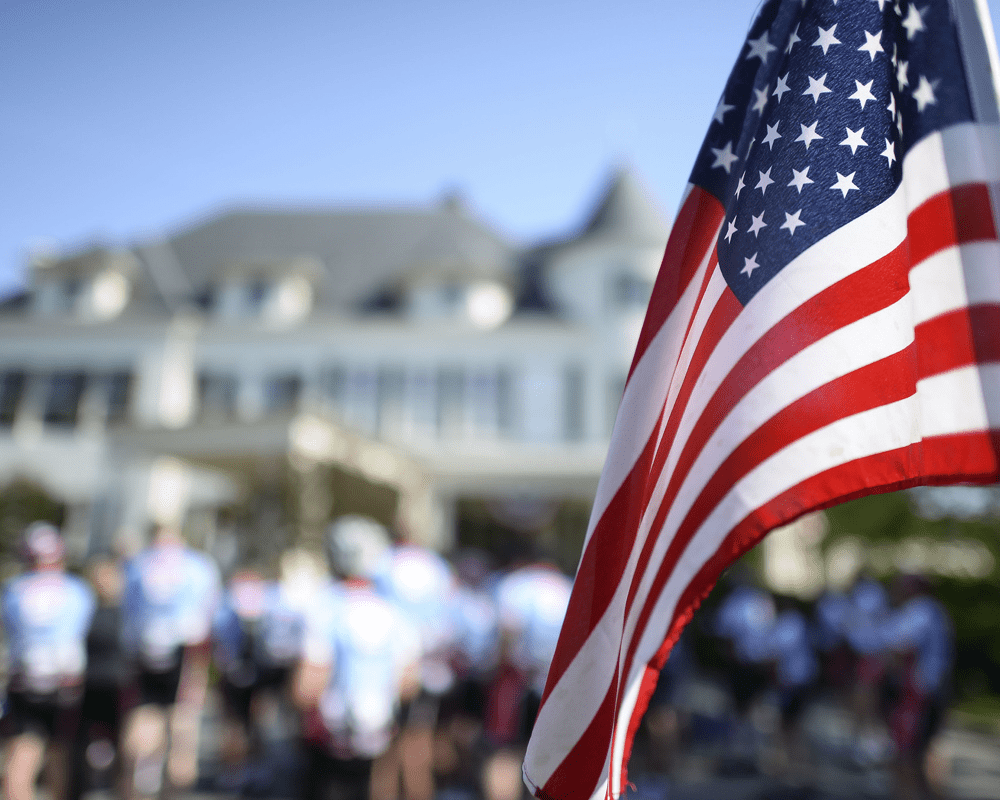 American flag waving in front of a building, USA immigration