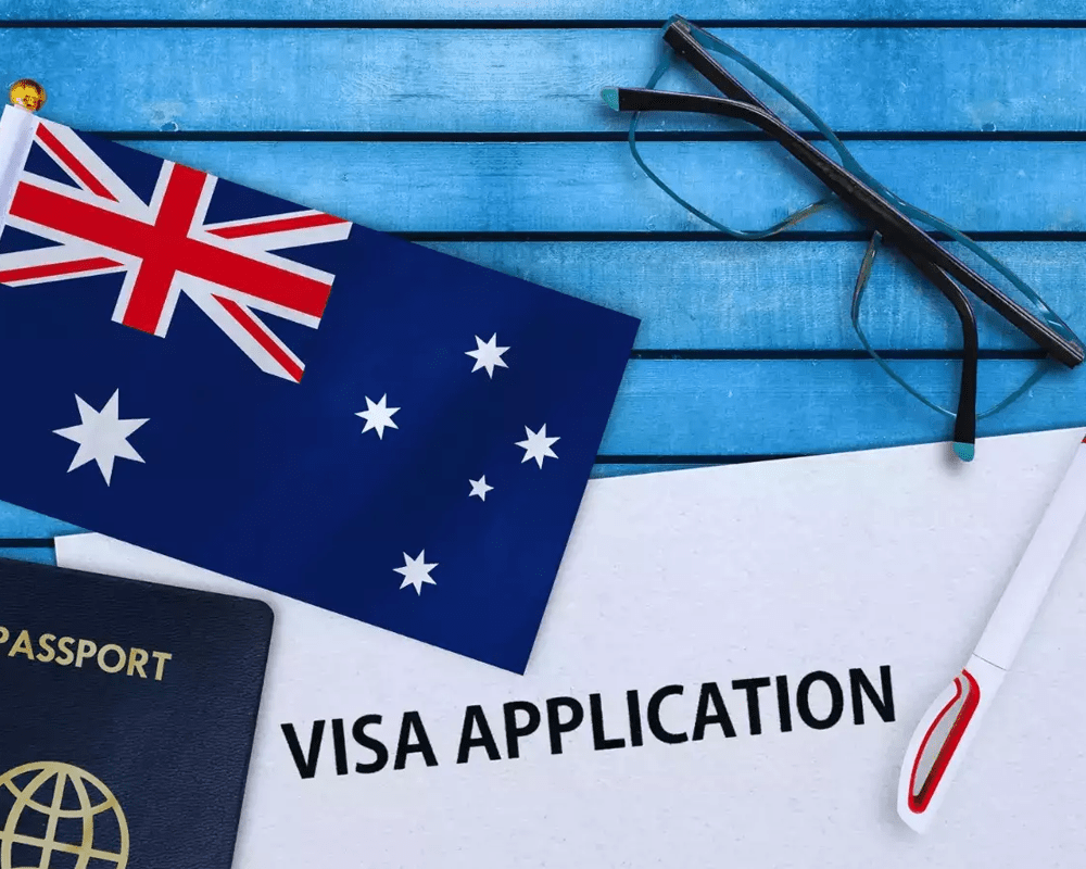 Australian flag with passport and visa application form