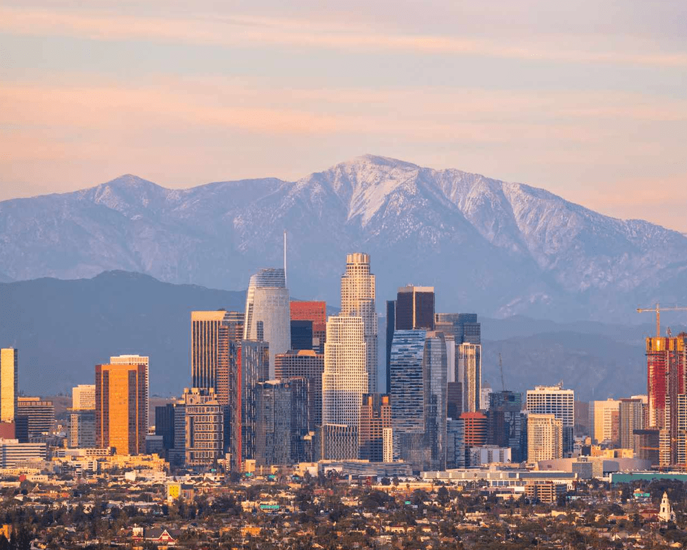 Los Angeles skyline with mountains at sunset, USA